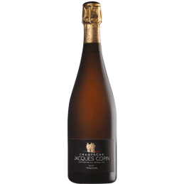 Flacon de Champagne Jacques Copin Brut Tradition avec reflets dorés et bulles fines
